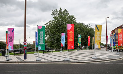 Colourful flags adding festive atmosphere to an outdoor event