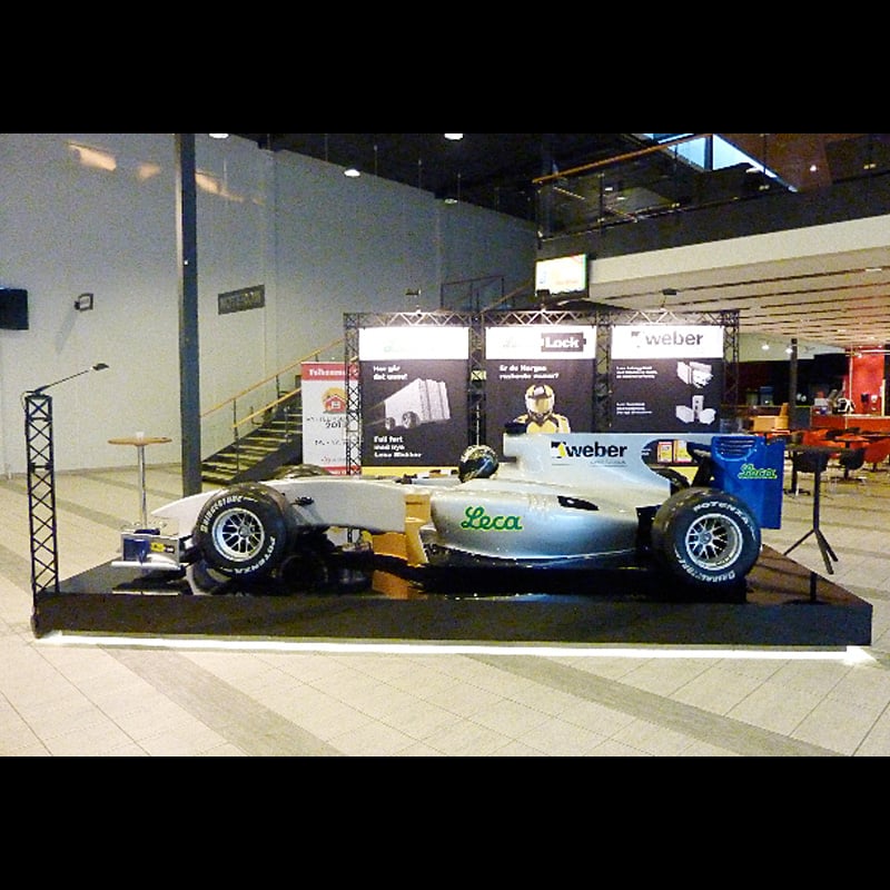 Race car displayed with exhibition truss
