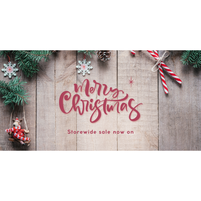 'Merry Christmas, storewide sale now on' on a wooden background'
